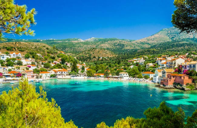 View of bay in Kefalonia with village and boats