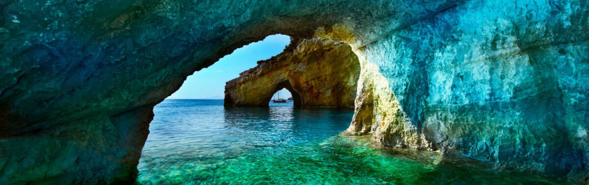 arch in rocks in turquoise water